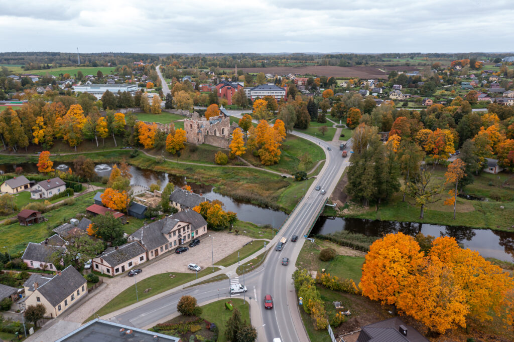 Aerial view of a quaint town with autumn foliage and historical