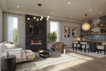 Living and dining area with fireplace at Aura Towns by Caivan in Mississauga