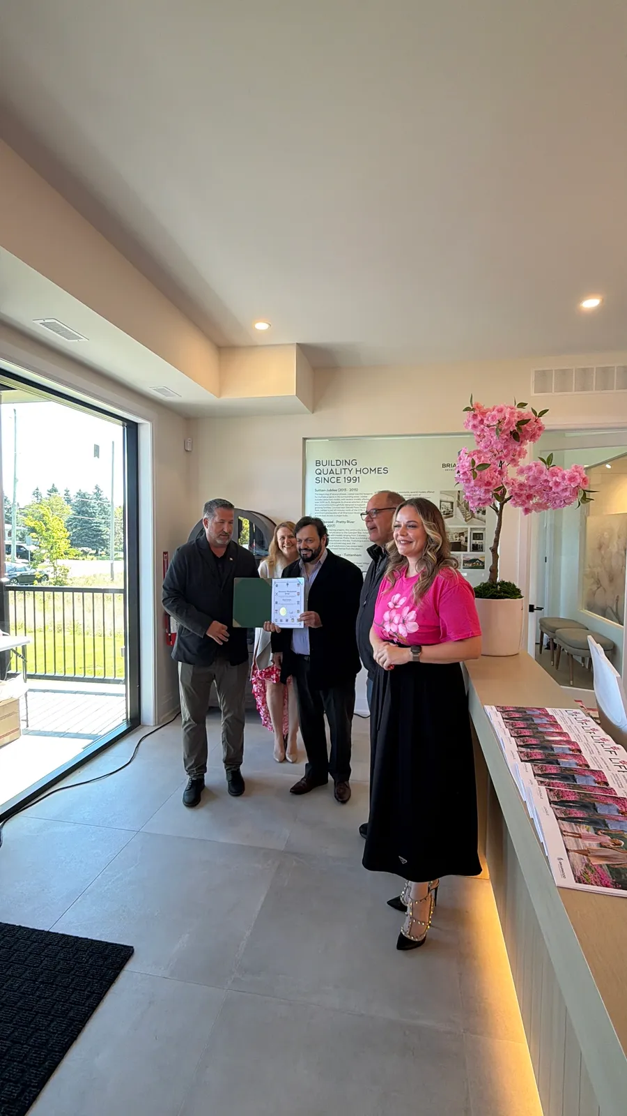 Guests and the Briarwood team inside the Avondale Village sales centre at the grand opening in Belleville, Ontario