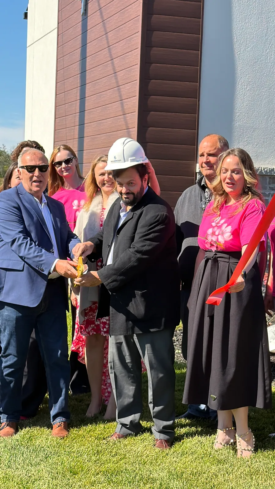 Ribbon cutting ceremony at the Avondale Village grand opening in Belleville