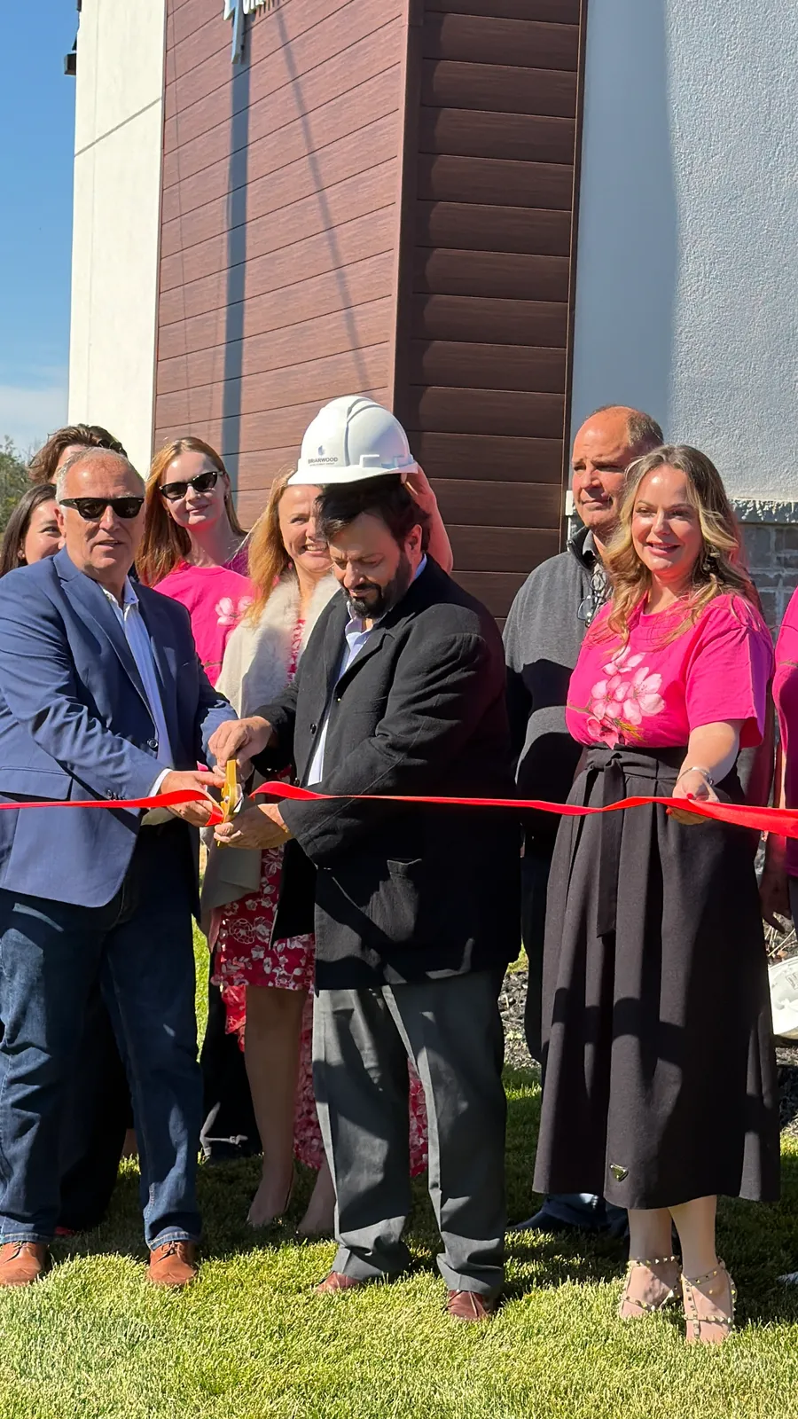 Briarwood team cutting the ribbon at the Avondale Village grand opening in Belleville