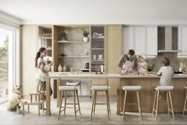 Open kitchen with family at Havendale by Cachet Homes in Brantford