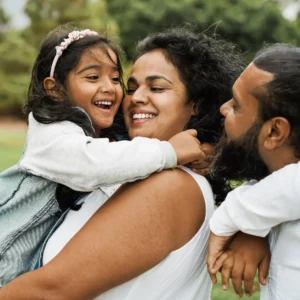 Family embracing outdoors representing Kingshaven by Kingsmen Group in Markham