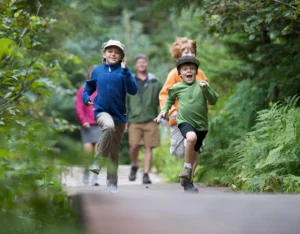 Family walking a forest trail near Vicinity West in Barrie