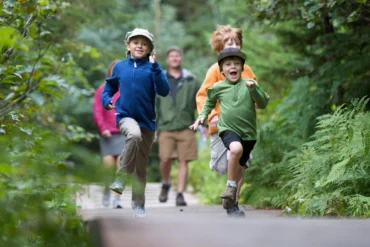Family walking a forest trail near Vicinity West in Barrie