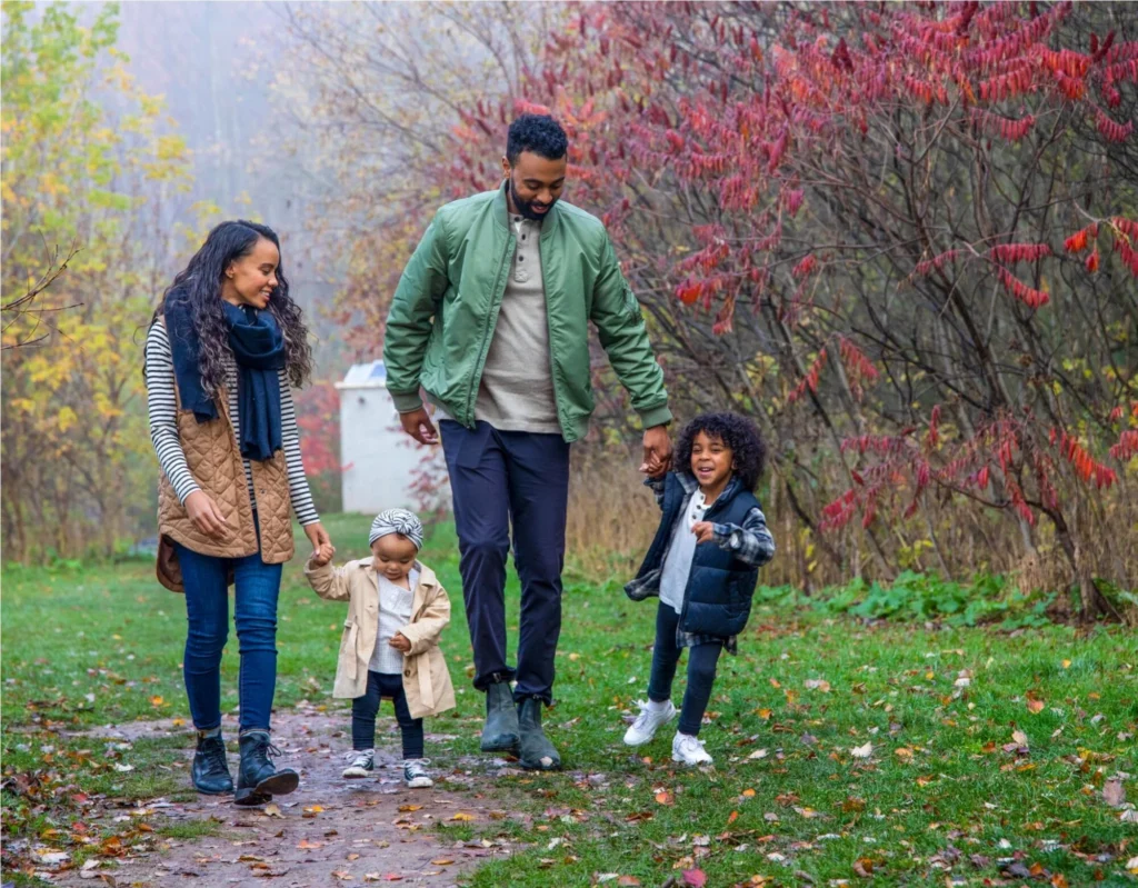 Family walking on a trail near Wildflowers by Mattamy Homes in Kitchener